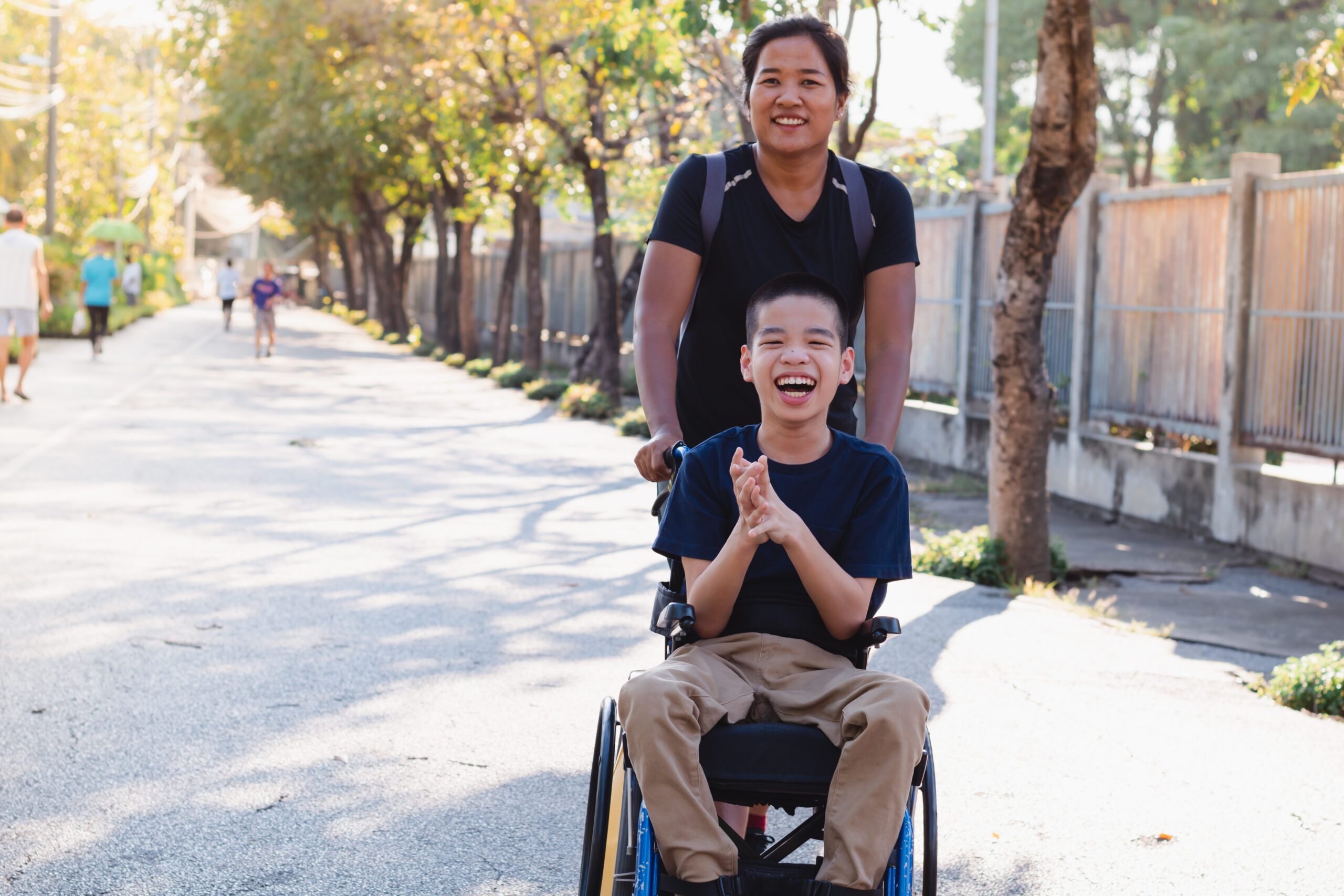 young boy in wheelchair smiling