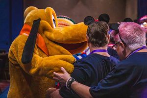 man with Disney character