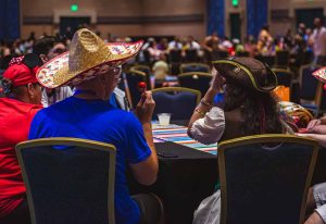 young adults sitting at table