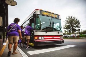 people with disabilities getting on bus to Disney World