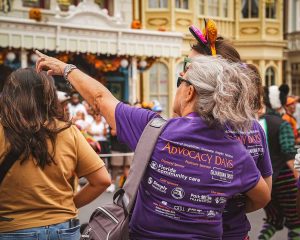lady pointing at parade at Disney World