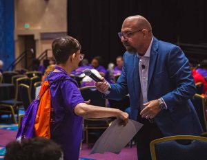 older lady speaking into microphone