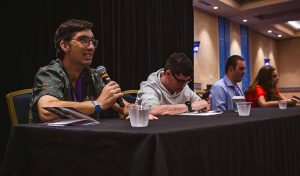 group of young adults sitting and talking