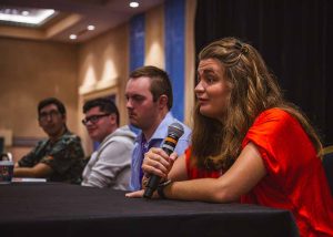 group of young adults sitting and talking