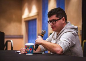young man sitting and talking