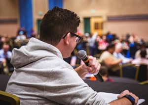 young man sitting and talking