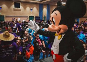 mickey mouse waving at crowd