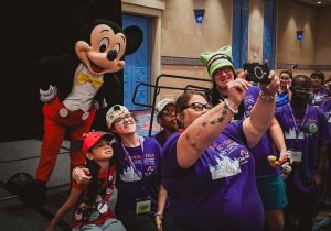 mickey mouse waving at crowd